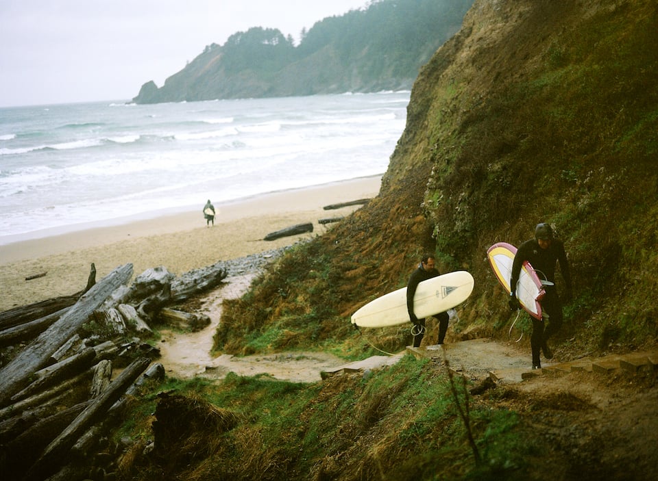 Surfing Oswald West State Park, Short Sands beach, Smugglers' Cove, Oregon Coast. Photo by Heidi Swift.