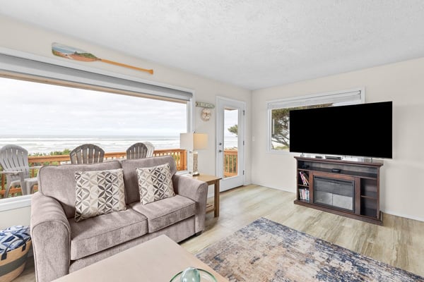 Wake up to stunning ocean views from your cozy living room, where morning coffee tastes even better with waves as your backdrop.